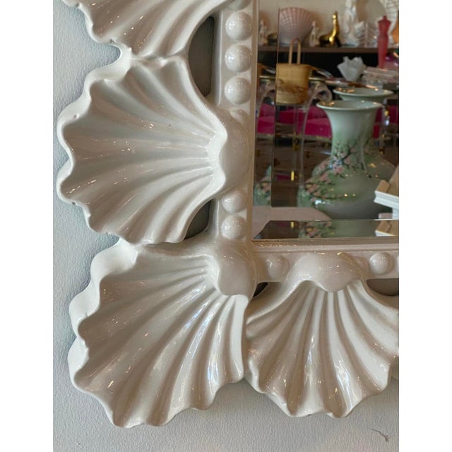 Such a beauty! Vintage scalloped seashell shell wall mirror. Newly lacquered in a soft white gloss. I love the ruffle like...
