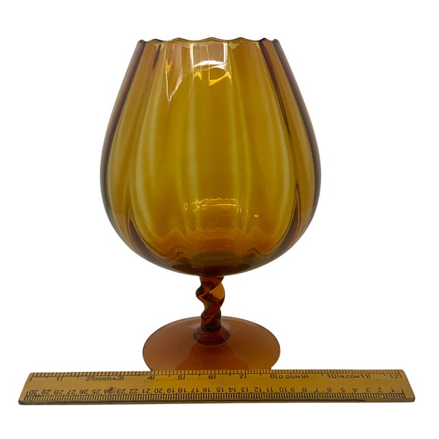 Vintage amber optic glass balloon vase featuring vertical ribbing, a scalloped rim, a short twisted stem, and a round...