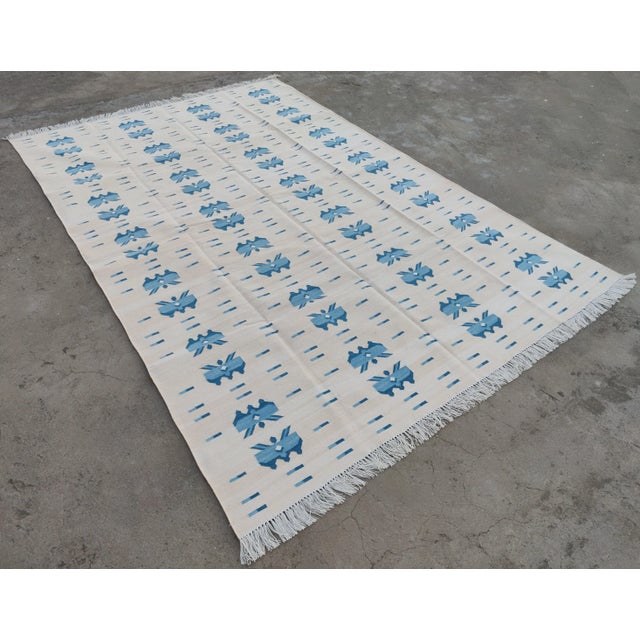 Cotton Vegetable Dyed Light Light Yellow And Sky Blue Butterfly Pattern Reversible Rug. These special flat-weave dhurries...