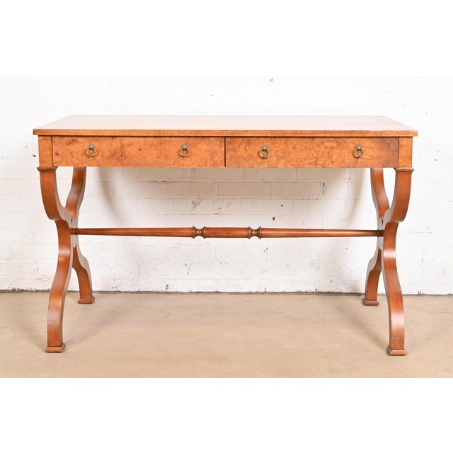 An exceptional Regency or Neoclassical style writing desk or library table By Baker Furniture USA, Circa 1980s Gorgeous...