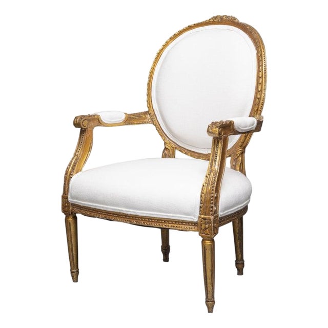 Early 20th Century 0ne of a Pair of Identical Louis XVI Style Gilt Wood Armchairs For Sale