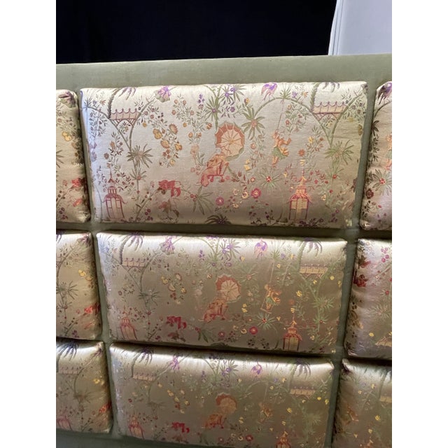 Queen size wood painted green headboard upholstered in a silky fabric. Upholstery is in blocked rows. Headboard made in...