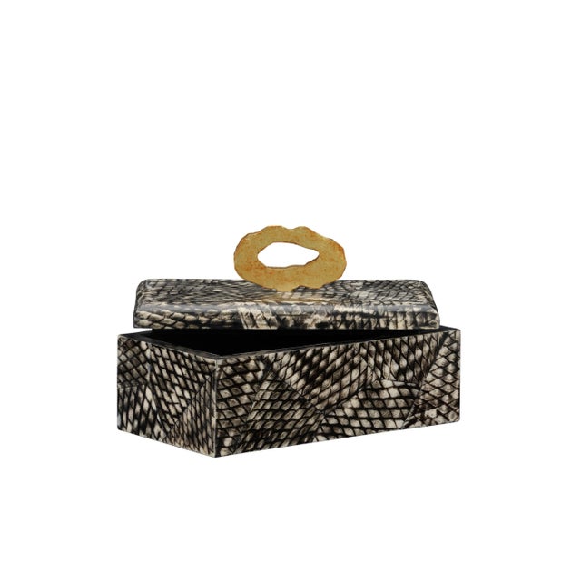 The Nazare box features a unique black fish scale finish to store small objects in style. The brass handle on the lidded...