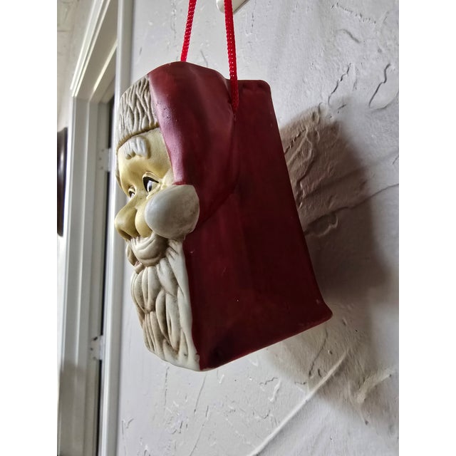 A charming vintage mid-century ceramic Santa Claus wall pocket planter. This festive piece features a beautifully...
