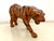A leather sculpted tiger statue, from India c.1970. The solid body is finished in an aged leather. The tiger has glass...