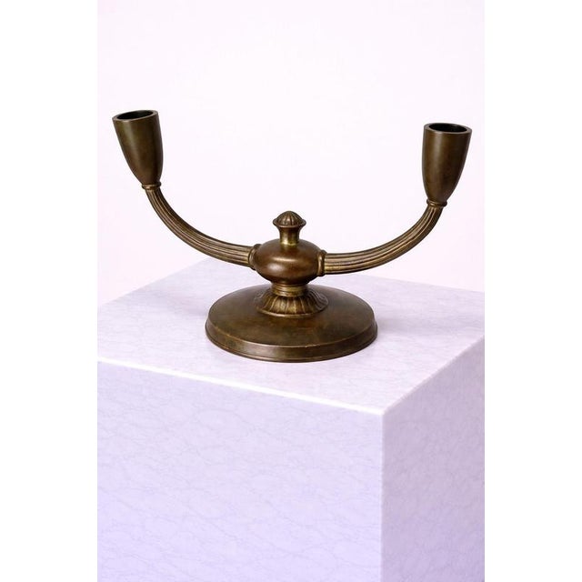 A refined swedish art deco bronze candelabra produced by gab (guldsmedsaktiebolaget), stockholm, circa 1930s. This elegant...