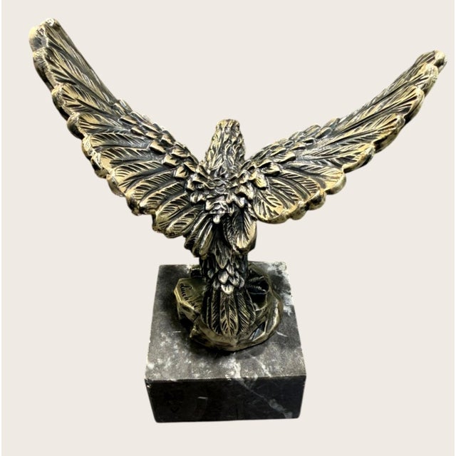 Striking vintage signed A. Lucchesi eagle sculpture featuring a dramatically posed bird of prey with wings fully spread,...