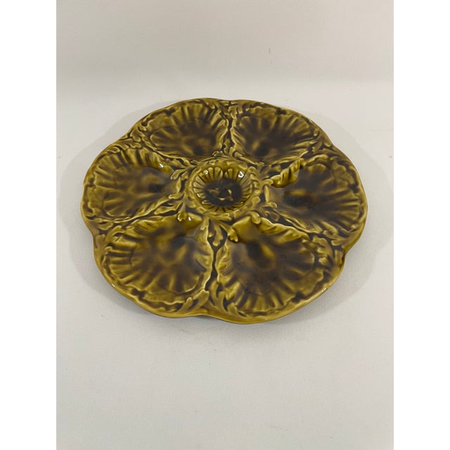 A striking glazed earthenware French Majolica (or barbotine) Oyster Plate crafted by the famous Gien workshop in France....