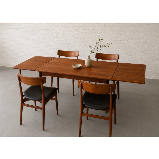 Danish Mid Century Modern TEAK Expandable DINING TABLE with two hidden leaves in a lovely streamlined size, perfect for...