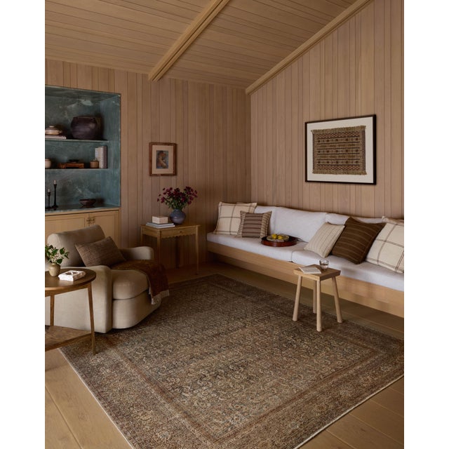 The Cambria Collection is a beautifully executed vintage-style area rug from Amber Lewis x Loloi with a blended jute and...