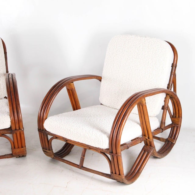 Rare pair of rattan armchairs, known as "pretzel" chairs, from the 1970s. They owe their name to their resemblance in...