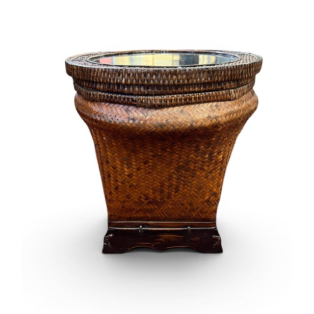 This pair of Mid-Century Modern storage accent tables, handwoven in Thailand during the 1960s, combines natural materials...