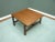 Discreet coffee table with reversible table top. The design comes from the 1960s. Solid teak frame. Table top veneered in...
