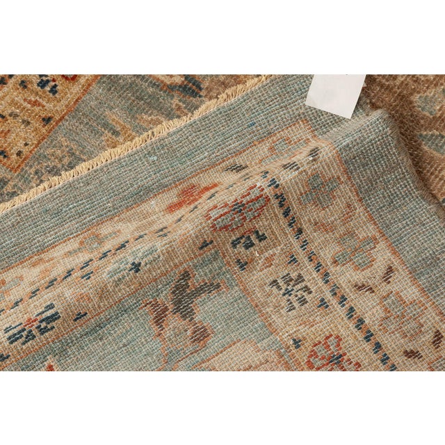 This magnificent Sultanabad-inspired rug captures the essence of Persian tradition while offering a palette refined for...