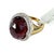Bold and captivating, this vintage style cocktail ring showcases a magnificent 12.78 carat oval-cut ruby, celebrated for...