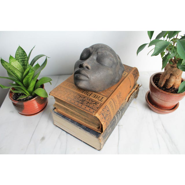 Gene Pearson signed non-glazed ceramic African female mask sculpture. Undated. Minor age wear. Gene Pearson (1946–2018)...
