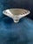 Crafted with exceptional weight and clarity, this signed Nambé art glass bowl features a dramatic, flared modern...