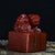 A substantial Chinese scholars' seal carved from warm, rich red-brown Shoushan stone with an oily, lustrous patina. The...