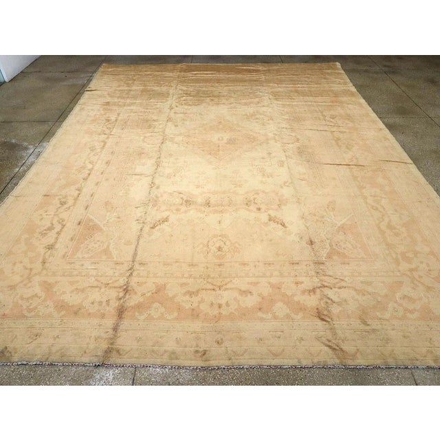An antique European Oushak large room size carpet. Not French. Not English. Not Spanish. Maybe Austrian. This is a high...
