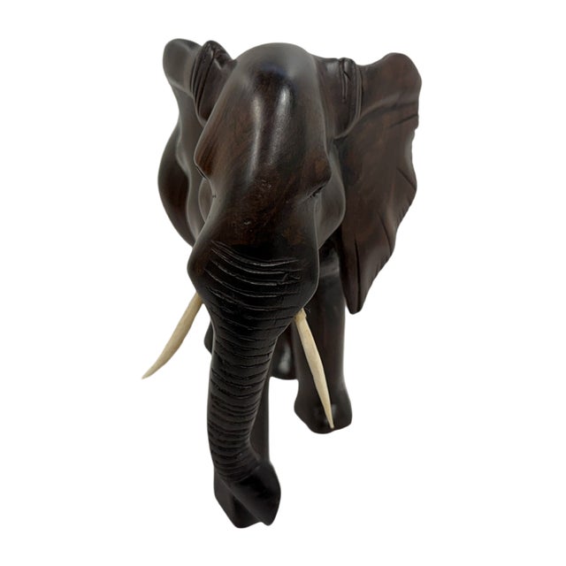 Mid-20th Century Hand-Carved Solid Ebony African Elephant Sculpture An exceptional mid-century hand-carved African...
