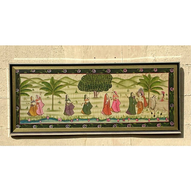 This exquisite vintage Pishwaa painting on silk features intricate artistry and vibrant colors that bring the scene to...