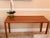An exceptional, minimalist Mid-Century Modern teak console table designed and manufactured by Sannemann in Denmark during...