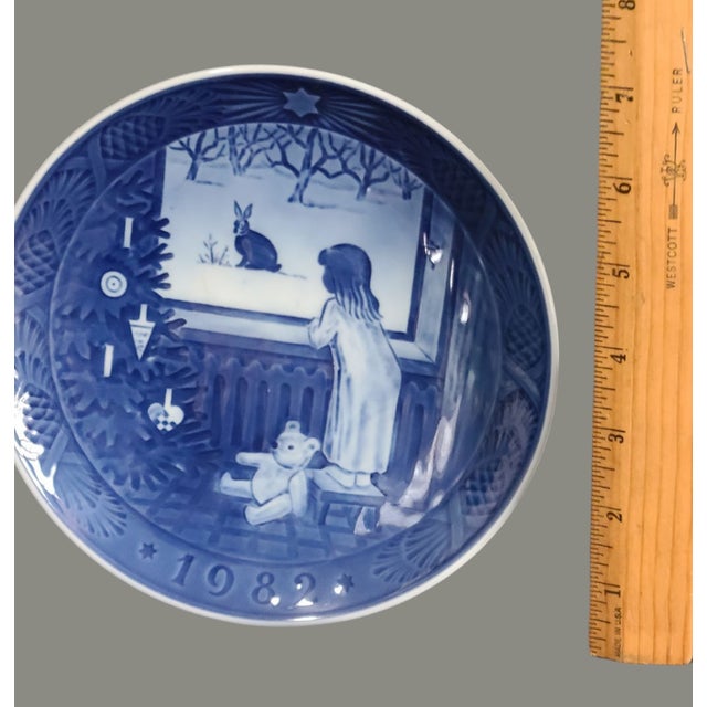 Crafted with the finest attention to detail, this Vintage 1982 Royal Copenhagen Waiting for Christmas plate is a true...