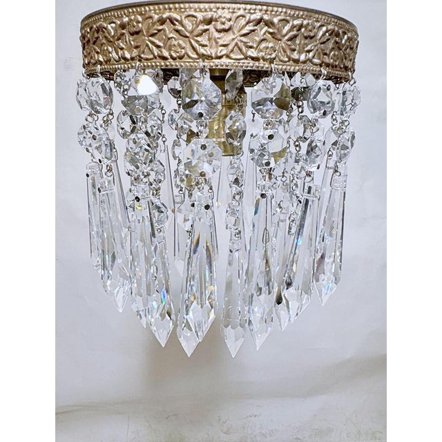 Italian layered chandelier with Brass rim, octagon bead chains and 30% leaded Strauss plug crystals. It has 1 Edison base...
