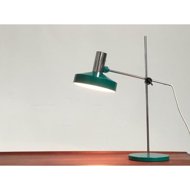 Simple table lamp from the renowned manufacturer Kaiser lights. The design language is simple and factual. The umbrella is...