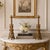 PAIR OF GRAND TOUR TRI-FORM BRONZE CANDLESTICKS IN THE MANNER OF GIUSEPPE BOSCHI Italian, 19th century Sand-cast gilt...