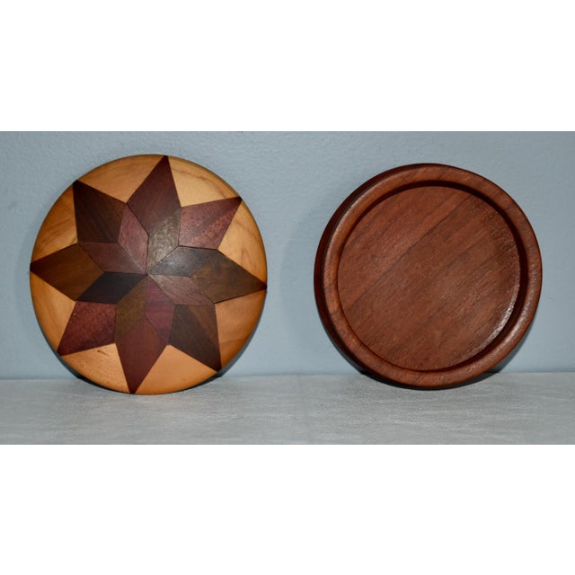Vintage (1980's) Round Trinket Box with a Star Design. Made of Exotic Inlaid Woods. The Measurements: 4.75" Diam. x 2"H....