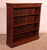 A charming small open bookcase in mahogany with inlays, dating from the 19th century in England. A beautiful and unusual...