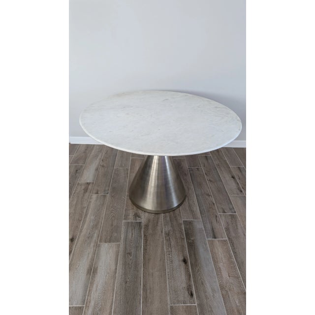 Solid marble top dining table from West Elm Metal base is a brushed nickel finish Made in India Purchased in 2017 44"...
