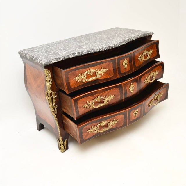 An important and absolutely stunning antique French Louis XV marble top commode by Jacques Bircklé. This was made in...