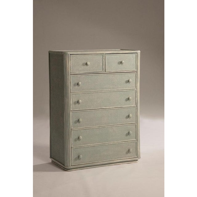 1960s chest of drawers in bamboo, with Vienna straw inserts on the sides and drawer fronts. Featuring wooden knobs, it has...