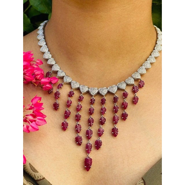 20.5 Carat Ruby and Diamond Drop Necklace in 18K Gold studded with leaf cut ruby. This stunning piece of jewelry instantly...