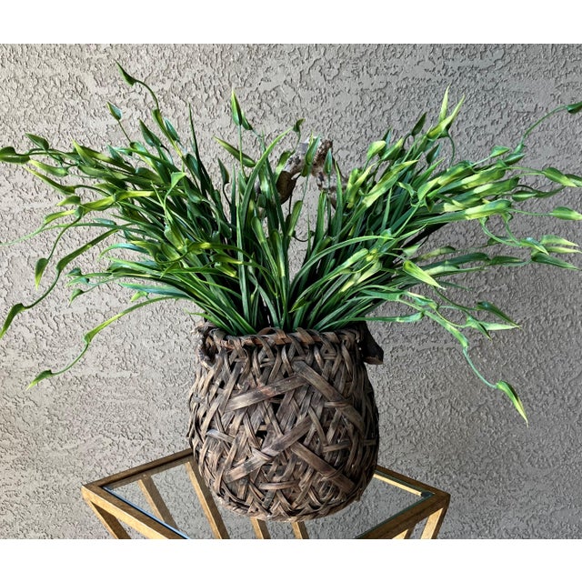 Note: Faux greens are not included. Fabulously rustic beauty handwoven using wood lashes and splints which have aged...