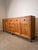 Impressive solid teak sideboard offering exceptional storage capacity and timeless craftsmanship. Featuring a warm natural...