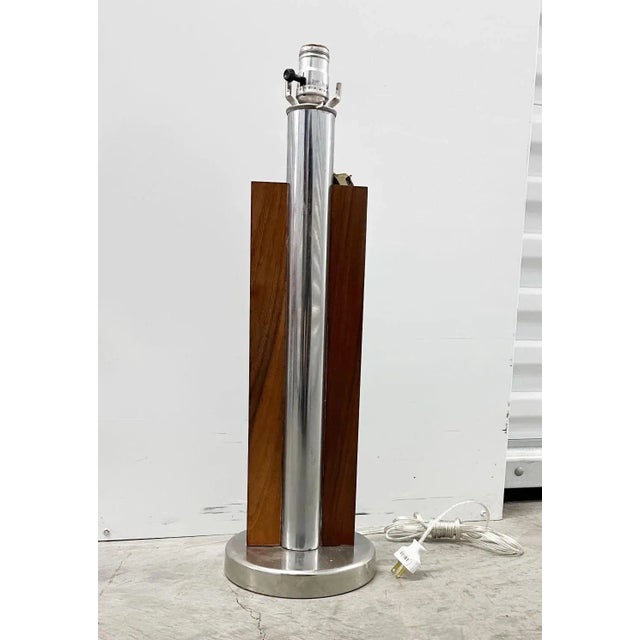 This mid-century modern table lamp created by The Lawrin Lamp Company has lines that are classic and elegant. It features...