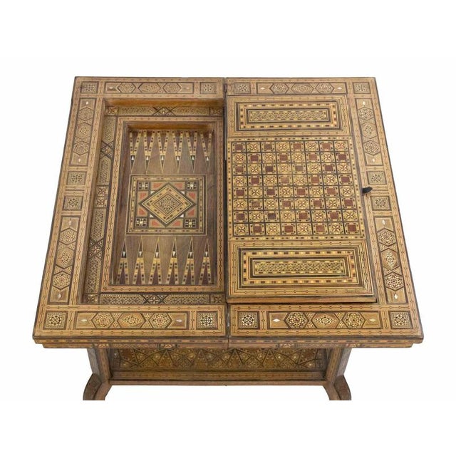 Vintage game table is a design item realized in the early 20th Century. A unique design table finely inlaid with...