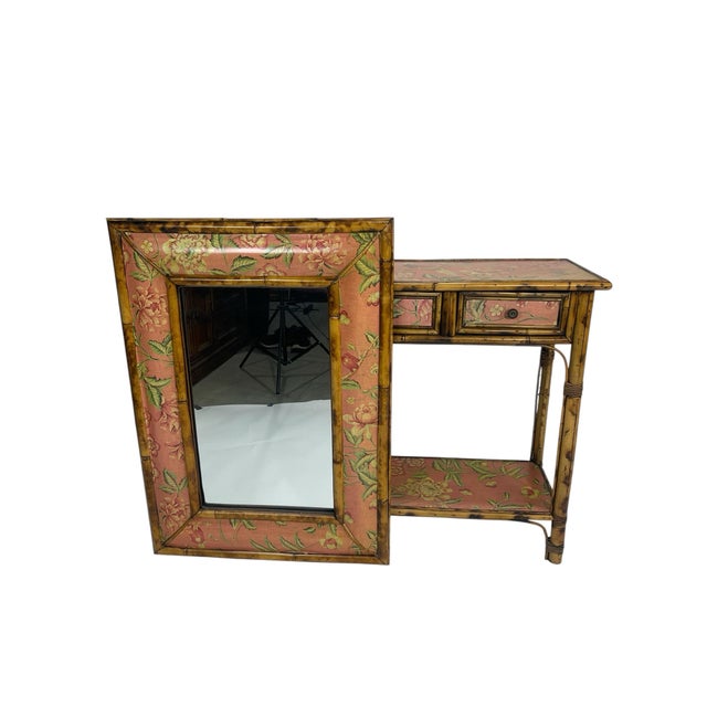 Mid-century Hollywood Regency faux bamboo vanity or console table with matching mirror, circa 1940s–1950s. Features...