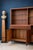 Elegant italian mid-century modern cabinet and bookcase, dating from approximately the 1950s and distinguished by its...