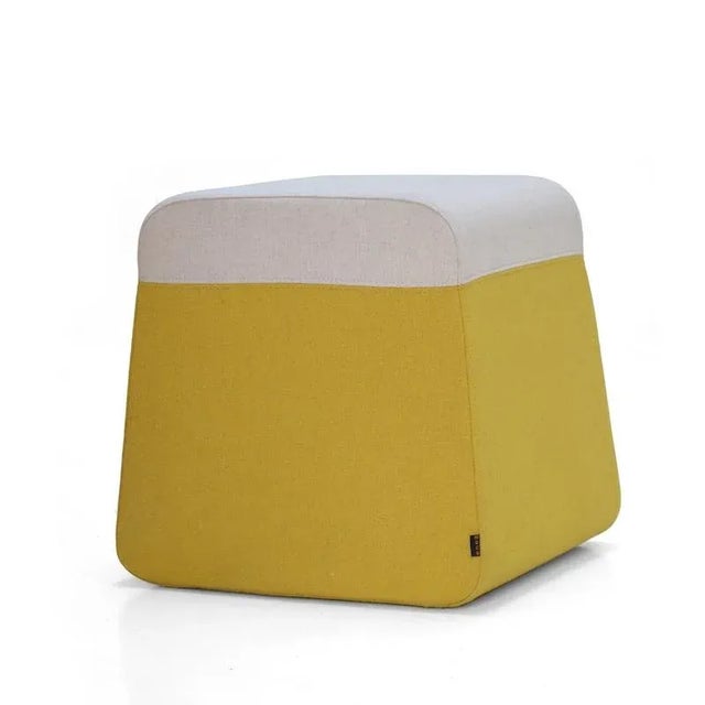 This fun and functional ottoman is available topped with felt or faux leather. The bottom comes in a variety of trendy...