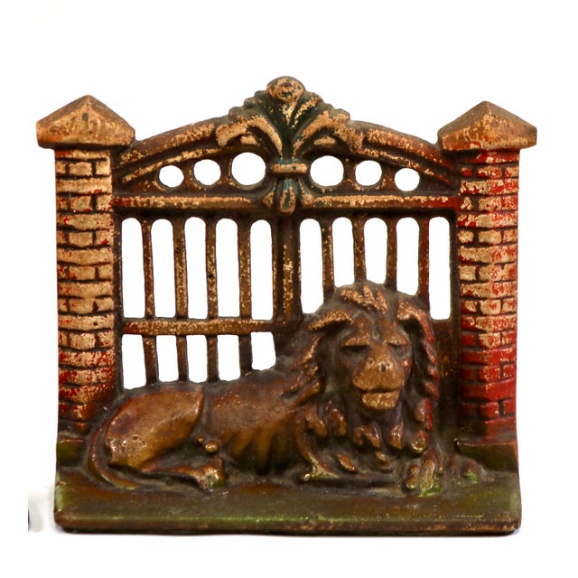 Beautiful, early 1900's cast iron bookends of a brave lion guarding a gate. Beautifully casted set! I love the details in...