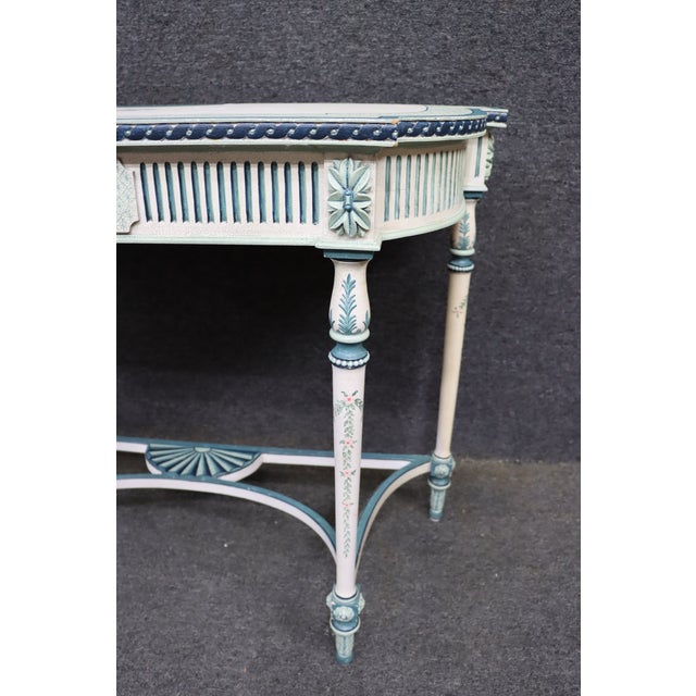 Hand-painted wooden accent table by Maitland-Smith Ltd., featuring a cream finish with teal accents, floral motifs, a...