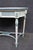 Hand-painted wooden accent table by Maitland-Smith Ltd., featuring a cream finish with teal accents, floral motifs, a...