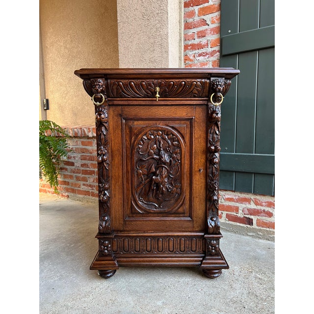 19th century French Carved Oak Hunt Cabinet Confiturier Black Forest Fox. Directly imported from France, a beautifully...