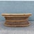 A stunning Boho Chic coffee table handcrafted from buri rattan, showcasing an elegant oval silhouette and exceptional...