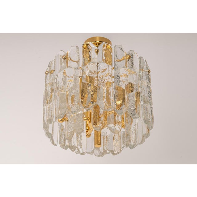Wonderful gilt brass light fixture comprises 15 crystal murano glass pieces on a gilded brass frame. It's made by kalmar...