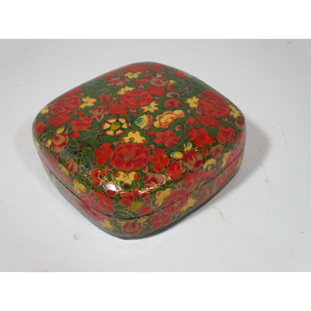 This 1970's lacquered papier mache' box is hand made and intricately painted by the artisans of Kashmir India. The box is...